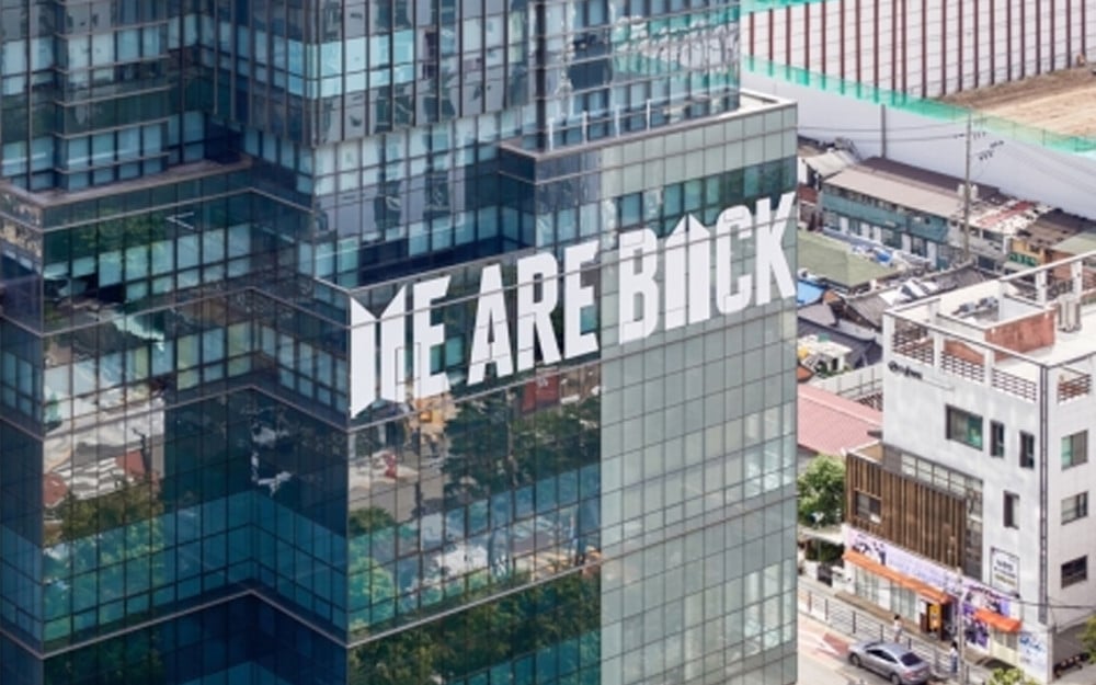 HYBE Headquarters Commemorates BTS's Return with "We Are Back" Window Decals 1 HYBE Headquarters Display
