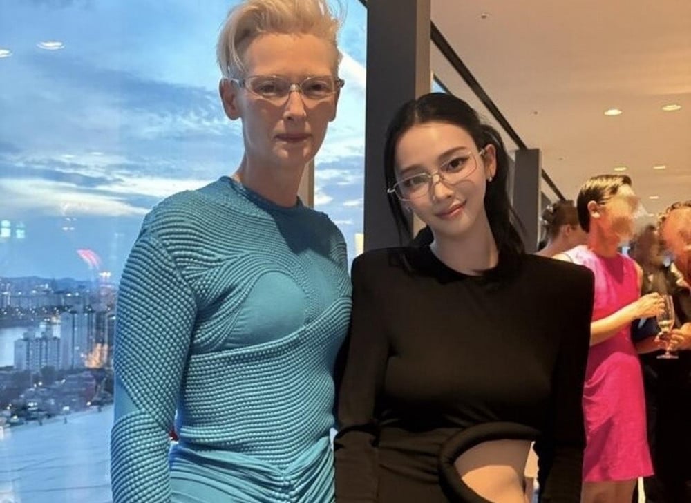 Karina Turns Heads in Black Cut-Out Dress Beside Tilda Swinton 1 Karina and Tilda Swinton at the eyewear event